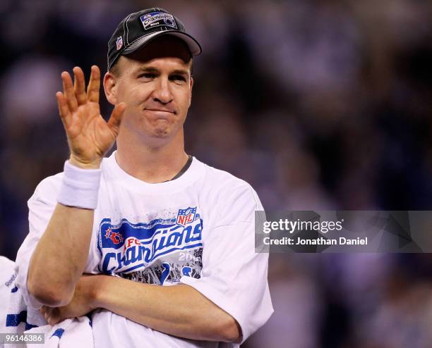 Quarterback Peyton Manning of the Indianapolis Colts celebrates during the presentation of the Lamar Hunt Trophy after defeating the New York Jets...