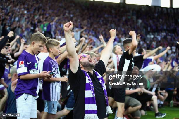 Fans of Aue celebrate after their team won the 2. Bundesliga Playoff Leg 2 match between Erzgebirge Aue and Karlsruher SC at...