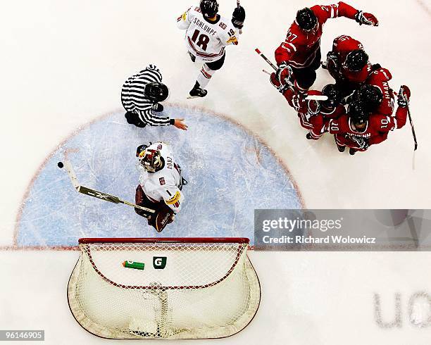 Members of Team Canada celebrate after scoring a goal on Benjamin Conz of Team Switzerland during the 2010 IIHF World Junior Championship Tournament...