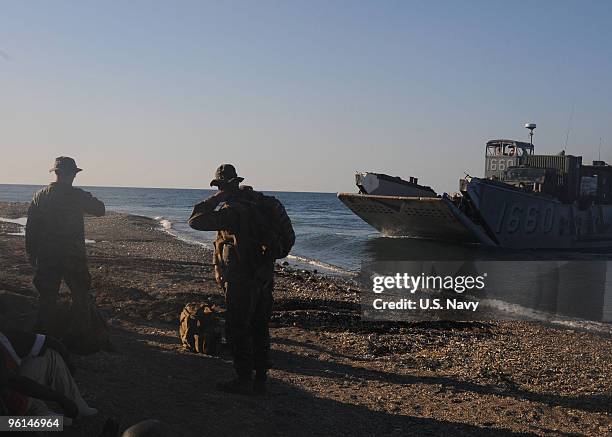 In this handout image provided by the U.S. Navy, Marines from the 22nd Marine Expeditionary Unit , embarked aboard the dock landing ship USS Fort...