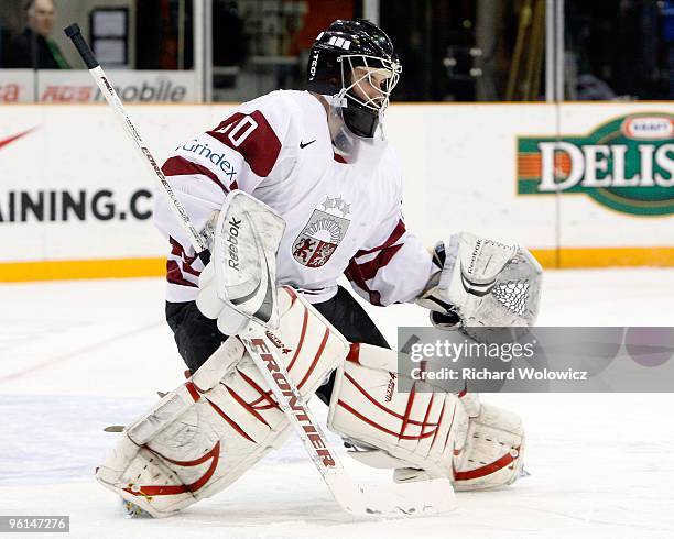Raimonds Ermics of Team Latvia watches play during the 2010 IIHF World Junior Championship Tournament Relegation game against Team Czech Republic on...