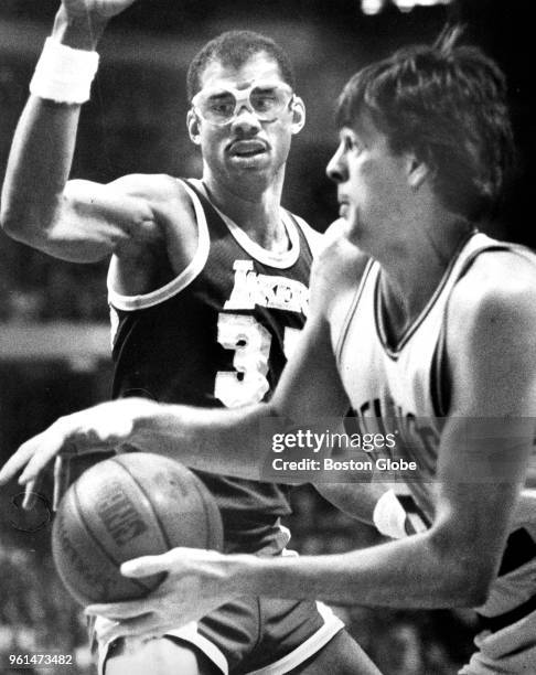 Los Angeles Lakers' Kareem Abdul-Jabbar, left, closely guards the Celtics' Kevin McHale as he tries to pass the ball under the Celtics basket. The...