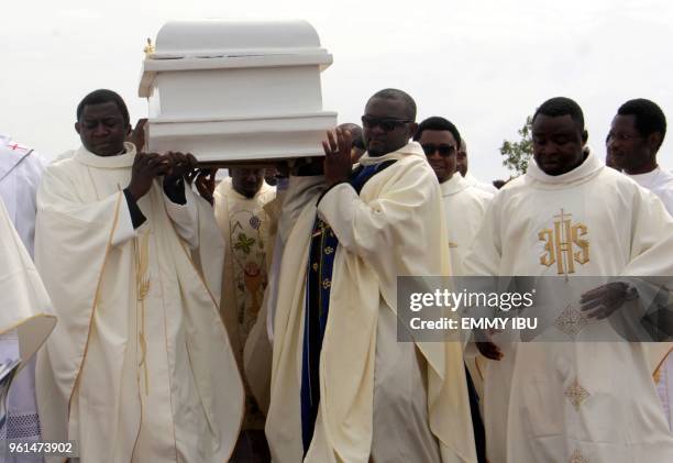 Clergymen carry a white coffin containing the body of a priest allegedly killed by Fulani herdsmen, for burial at Ayati-Ikpayongo in Gwer East...