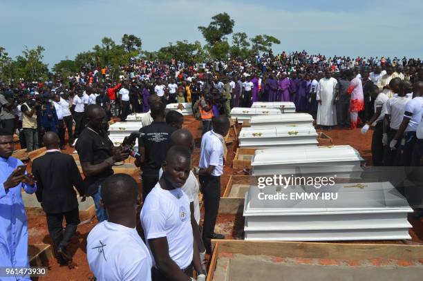 Coffins are prepared for burial during a funeral service for 17 worshippers and two priests, who were allegedly killed by Fulani herdsmen, at...