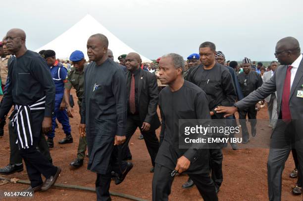 Nigeria's vice-President Yemi Osinbajo is accompanied by Benue Governor Samuel Ortom as he arrives to attend the funeral service of 17 worshippers...