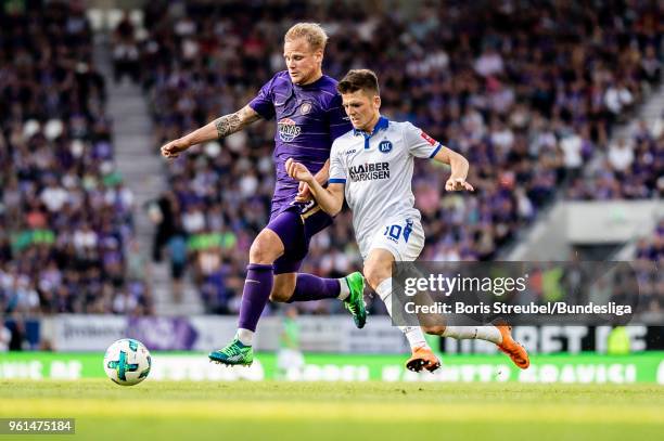 Soeren Bertram of Erzgebirge Aue in action with Marvin Wanitzek of Karlsruher SC during the 2. Bundesliga Playoff Leg 2 match between Erzgebirge Aue...