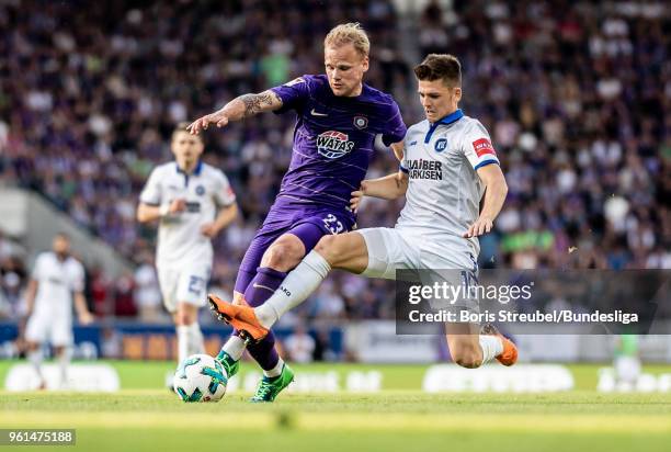 Soeren Bertram of Erzgebirge Aue in action with Marvin Wanitzek of Karlsruher SC during the 2. Bundesliga Playoff Leg 2 match between Erzgebirge Aue...