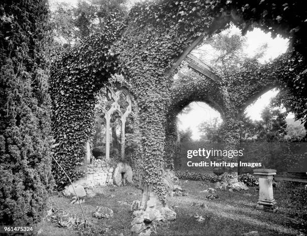 Abingdon Abbey, Oxfordshire, 1892. Overgrown arcades and windows of the sham abbey ruin in the gardens of Abingdon Abbey. Artist Henry Taunt.