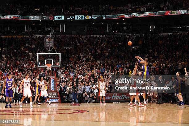 Kobe Bryant of the Los Angeles Lakers throws up a last second shot to win the game, but rattles out during a contest against the Toronto Raptors on...