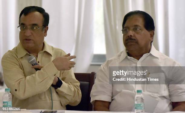 President Ajay Maken speaks as Delhi AICC in-charge P. C. Chacko looks on during a monthly meeting with AICC Secretaries and former DPCC Presidents,...