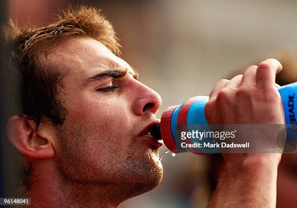 Jobe Watson captain of the Bombers takes a drink break during an Essendon Bombers AFL training session at Windy Hill on January 25, 2010 in...