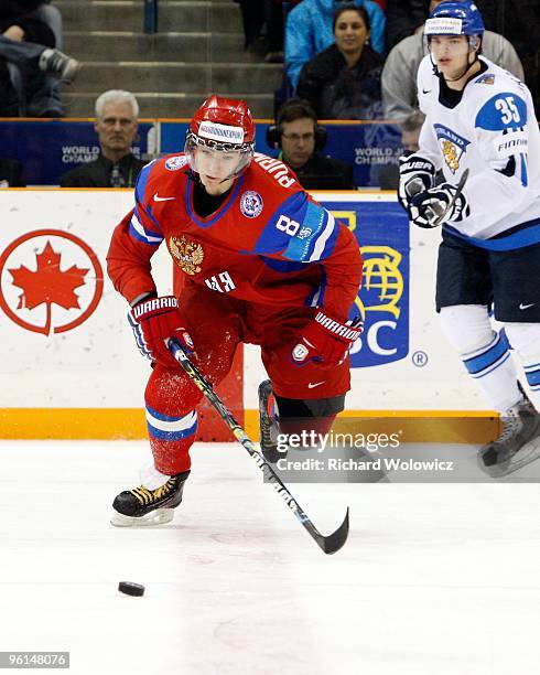 Alexander Burmistrov of Team Russia skates with the puck during the 2010 IIHF World Junior Championship Tournament Fifth Place game against Team...