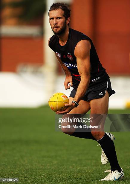 Mark McVeigh of the Bombers handballs to a teammate during an Essendon Bombers AFL training session at Windy Hill on January 25, 2010 in Melbourne,...