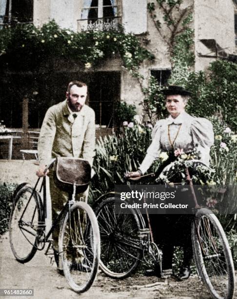 Pierre and Marie Curie, French physicists, preparing to go cycling. Polish-born Marie Curie and her husband Pierre continued the work on...