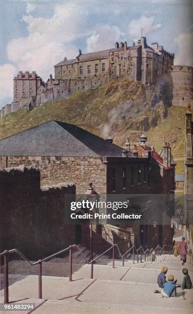 Edinburgh. Viewed from an Old Town, Edinburgh Castle seems as invulnerable by time as the rock on which it is built', circa 1930s. From Geographical...