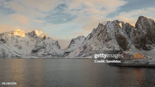 fishing village sakrisoy on lofoten islands (norway) during a sunny winter day - rorbuer stock pictures, royalty-free photos & images