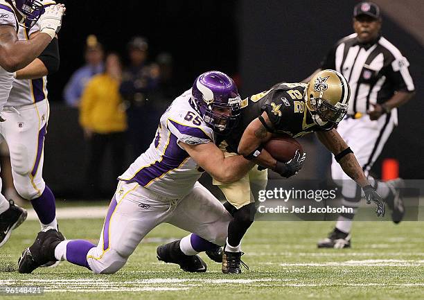 Tracy Porter of the New Orleans Saints intercepts a pass and returns in for positive yards late in the fourth quarter against John Sullivan of the...