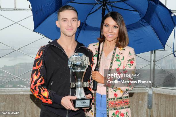 Figure skater Adam Rippon and dancer Jenna Johnson pose together for a photo to celebrate the 'Dancing With The Stars' Finale at The Empire State...