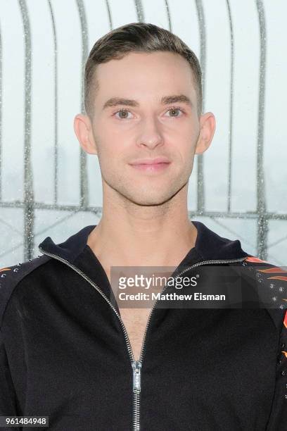 Figure skater Adam Rippon poses for a photo to celebrate the 'Dancing With The Stars' Finale at The Empire State Building on May 22, 2018 in New York...