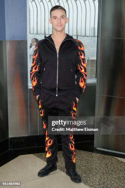 Figure skater Adam Rippon poses for a photo to celebrate the 'Dancing With The Stars' Finale at The Empire State Building on May 22, 2018 in New York...