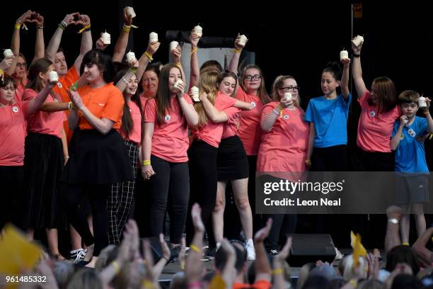 The Manchester Survivors Choir performs during the 'Manchester Together - With One Voice' Arena Bombing Tribute concert at Albert Square on May 22,...