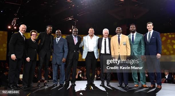 Adam Graves, Billie Jean King, Tina Charles, Mookie Wilson, Earl Monroe, Alex Rodriguez, John McEnroe, Harry Carson, Justin Tuck and Eli Manning pose...