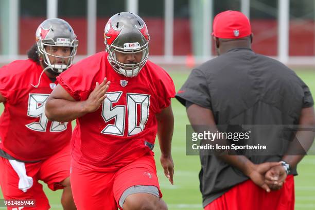 First round pick Vita Vea goes thru drills under the close eye of defensive line coach Brentson Buckner during the Tampa Bay Buccaneers OTA on May...