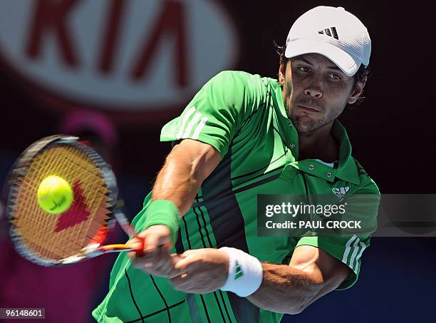 Fernando Verdasco of Spain hits a return against Nikolay Davydenko of Russia in their men's singles fourth round match on day eight of the Australian...