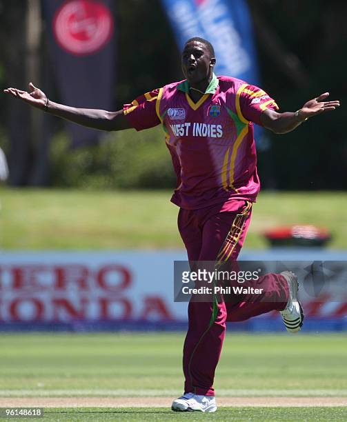 Jason Holder of the West Indies celebrates his wicket of Ahmed Shehzad of Pakistan during the ICC U19 Cricket World Cup semi final match between the...