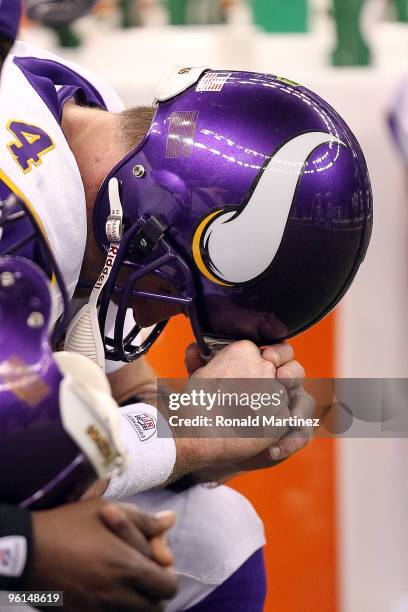 Brett Favre of the Minnesota Vikings sits on the bench towards the end of the game against the New Orleans Saints during the NFC Championship Game at...