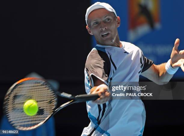 Nikolay Davydenko of Russia hits a return against Fernando Verdasco of Spain in their men's singles fourth round match on day eight of the Australian...