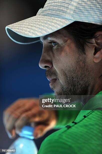 Fernando Verdasco of Spain has a drink of water between games while playing against Nikolay Davydenko of Russia in their men's singles fourth round...