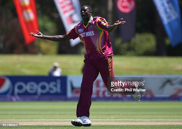 Jason Holder of the West Indies celebrates his wicket of Ahmed Shehzad of Pakistan during the ICC U19 Cricket World Cup semi final match between the...