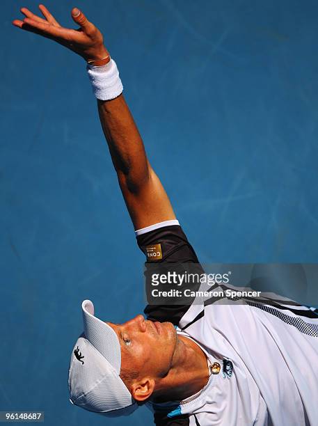 Nikolay Davydenko of Russia serves in his fourth round match against Fernando Verdasco of Spain during day eight of the 2010 Australian Open at...