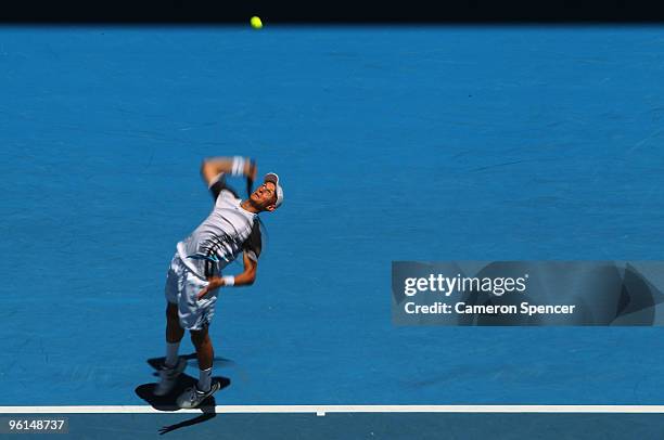 Nikolay Davydenko of Russia serves in his fourth round match against Fernando Verdasco of Spain during day eight of the 2010 Australian Open at...