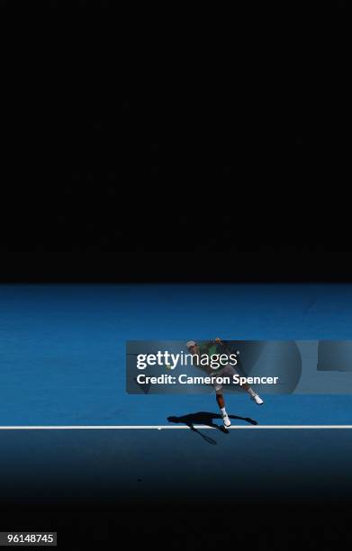 Fernando Verdasco of Spain serves in his fourth round match against Nikolay Davydenko of Russia during day eight of the 2010 Australian Open at...