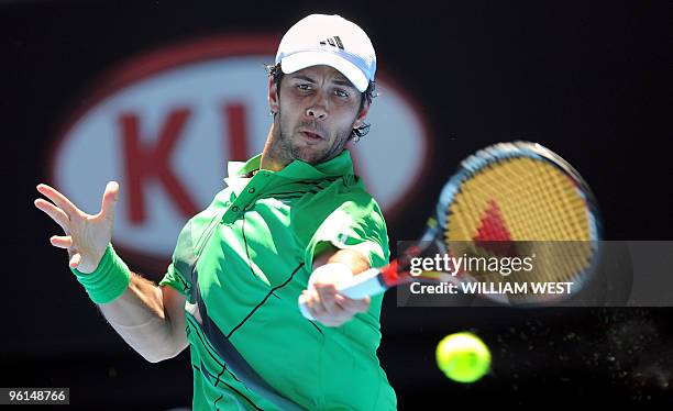 Fernando Verdasco of Spain hits a return against Nikolay Davydenko of Russia in their men's singles fourth round match on day eight of the Australian...