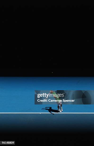 Fernando Verdasco of Spain serves in his fourth round match against Nikolay Davydenko of Russia during day eight of the 2010 Australian Open at...