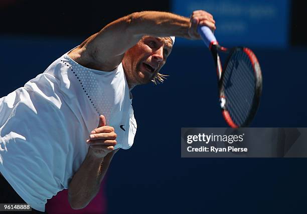 Lukasz Kubot of Poland serves in his fourth round match against Novak Djokovic of Serbia during day eight of the 2010 Australian Open at Melbourne...