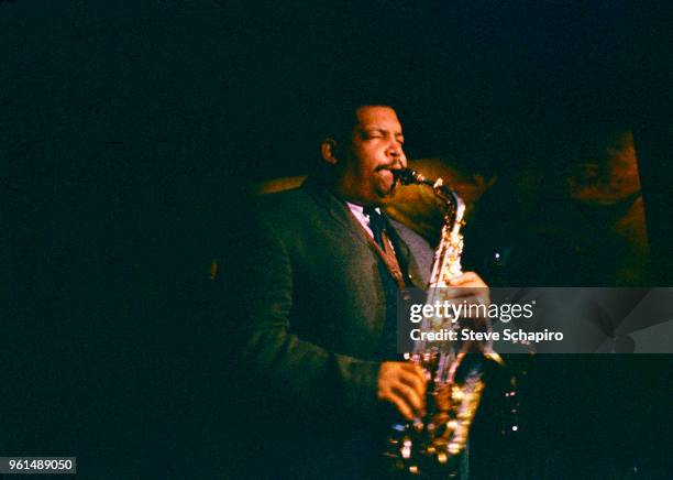 American Jazz musician Julian Cannonball Adderley plays saxophone as he performs onstage at the Village Vanguard nightclub, New York, New York, 1961.