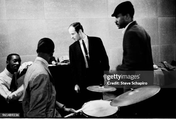 American Jazz musician Sam Jones talks with fellow musicians, among them pianist Joe Zawinul , New York, 1961.