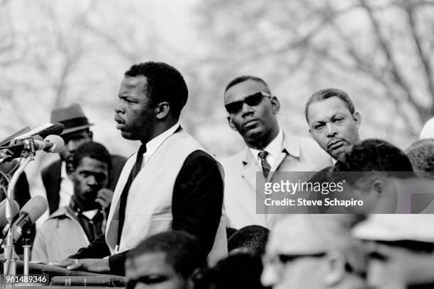 Student Non-violent Coordinating Committee President John Lewis speaks in front of the Montgomery State Capitol building at the conclusion of the...
