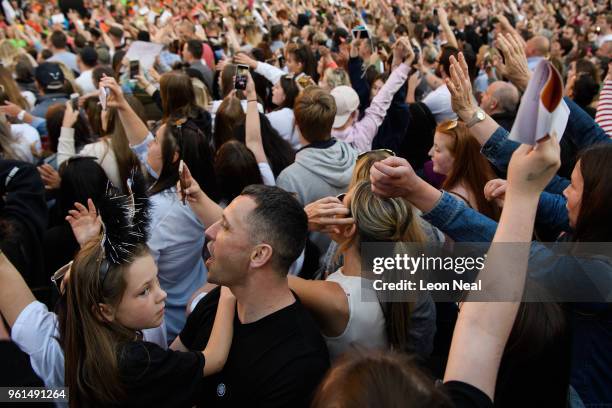 The audience sing along to "Don't Look Back In Anger" by Oasis during the 'Manchester Together - With One Voice' Arena Bombing tribute concert at...