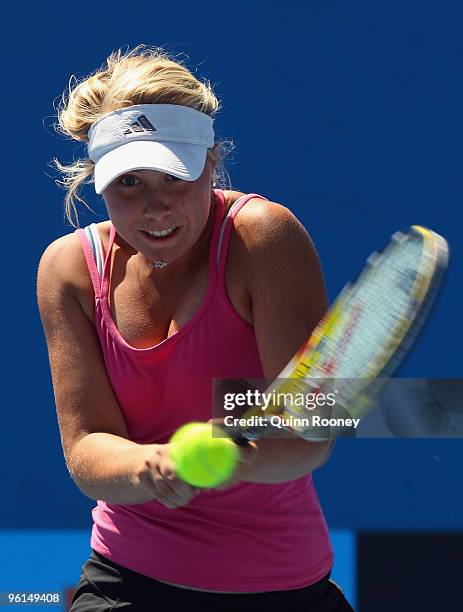 Abbie Myers of Australia plays a backhand in her first round junior doubles match with Storm Sanders of Australia against Karolina Pliskova and...