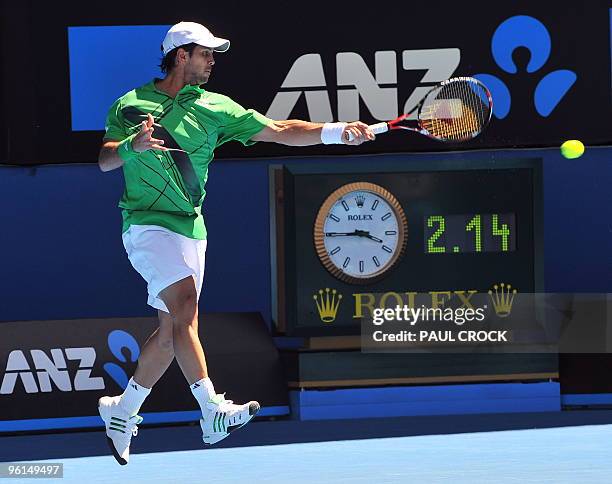 Fernando Verdasco of Spain hits a return against Nikolay Davydenko of Russia in their men's singles fourth round match on day eight of the Australian...