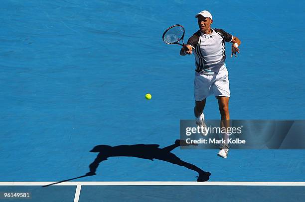 Nikolay Davydenko of Russia plays a forehand in his fourth round match against Fernando Verdasco of Spain during day eight of the 2010 Australian...