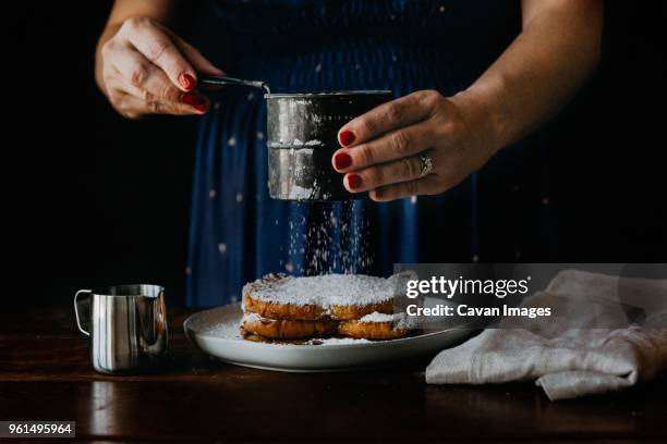 midsection of woman making breakfast on table at home - pain perdu stock pictures, royalty-free photos & images