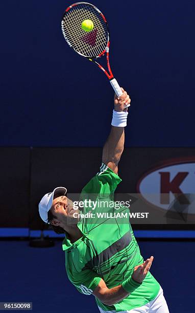 Fernando Verdasco of Spain serves against Nikolay Davydenko of Russia in their men's singles fourth round match on day eight of the Australian Open...