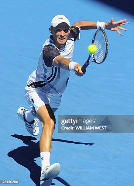 Nikolay Davydenko of Russia hits a return against Fernando Verdasco of Spain in their men's singles fourth round match on day eight of the Australian...