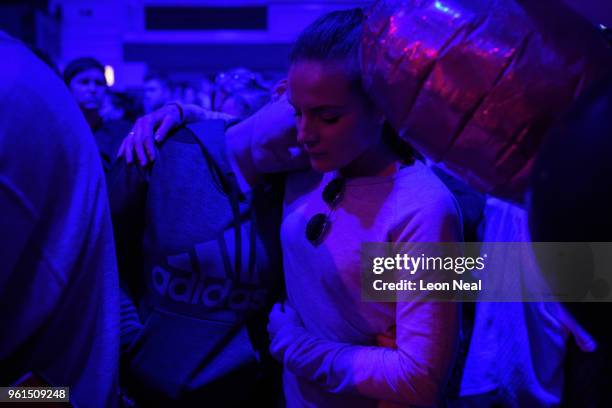 Young women hug during a silence held at 22:31, exactly one year after the bomb detonated, on the first anniversary of the terrorist attack in...